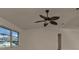 Bright living room with ceiling fan and natural light coming from large windows at 17341 Sabrina Cir, Port Charlotte, FL 33948