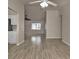 Open living area showing tile floors, ceiling fan and lots of natural light at 17341 Sabrina Cir, Port Charlotte, FL 33948
