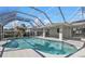 Enjoy Florida living with a beautiful pool, screened-in lanai, and a spacious outdoor area at 17341 Sabrina Cir, Port Charlotte, FL 33948