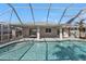 The screened-in pool has an attached covered patio and access to the home's interior at 17341 Sabrina Cir, Port Charlotte, FL 33948