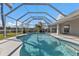 The screened in pool area includes a covered patio with a ceiling fan and outdoor lighting at 17341 Sabrina Cir, Port Charlotte, FL 33948