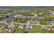Aerial view of a neighborhood with houses near the water at 17341 Sabrina Cir, Port Charlotte, FL 33948