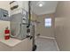 Utility room featuring neutral walls, utility equipment and tile flooring at 17341 Sabrina Cir, Port Charlotte, FL 33948