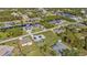 Aerial view of a residential area with houses and canals at 17341 Sabrina Cir, Port Charlotte, FL 33948