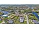 Aerial view of a neighborhood with waterfront properties and canals at 17341 Sabrina Cir, Port Charlotte, FL 33948