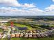 Property surrounded by water and golf course, shown in aerial view at 5241 Grand Palmetto Way, North Port, FL 34291