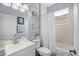 Cozy bathroom with vanity, toilet and shower/tub combo with natural light at 5241 Grand Palmetto Way, North Port, FL 34291