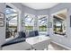 Breakfast nook features a window seat, views of the backyard, and a small table for dining at 5241 Grand Palmetto Way, North Port, FL 34291