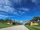 Scenic view of the bridge at Herons Creek under a beautiful blue sky with whispy clouds at 5241 Grand Palmetto Way, North Port, FL 34291