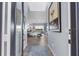 Open foyer with hardwood floors leading into the spacious living area, bathed in natural light at 5241 Grand Palmetto Way, North Port, FL 34291