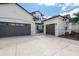 Spacious three-car garage with a patterned concrete driveway and well-maintained landscaping at 5241 Grand Palmetto Way, North Port, FL 34291