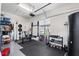 Garage equipped as a home gym with weights, a punching bag, and various exercise equipment at 5241 Grand Palmetto Way, North Port, FL 34291