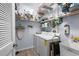 Functional laundry room with washer, dryer, sink, and ample storage space at 5241 Grand Palmetto Way, North Port, FL 34291
