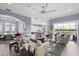 Bright living room with views of the backyard pool, seamlessly integrating indoor and outdoor living at 5241 Grand Palmetto Way, North Port, FL 34291