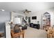 Comfortable living room with neutral decor, cozy seating, and decorative built-in shelving at 5241 Grand Palmetto Way, North Port, FL 34291