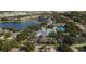 Community overview with pool, tennis courts, and lake at 1274 White Oak Trl, Port Charlotte, FL 33948