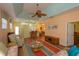 Open living area with kitchen and dining area view, wicker furniture and hardwood floors at 1274 White Oak Trl, Port Charlotte, FL 33948