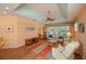Bright living room with wicker furniture and view of backyard at 1274 White Oak Trl, Port Charlotte, FL 33948