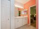 Double vanity bathroom with coral walls at 1274 White Oak Trl, Port Charlotte, FL 33948
