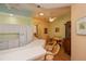 Kitchen with white cabinets, island, and breakfast bar at 1274 White Oak Trl, Port Charlotte, FL 33948
