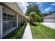 Sidewalk leading to home entrance with landscaping at 1274 White Oak Trl, Port Charlotte, FL 33948