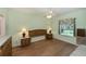 Spacious bedroom with wood flooring and large window at 1274 White Oak Trl, Port Charlotte, FL 33948