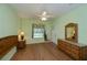 Light and airy bedroom with wood floors and sliding glass door at 1274 White Oak Trl, Port Charlotte, FL 33948