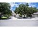 Exterior view of three-car garage and driveway at 1274 White Oak Trl, Port Charlotte, FL 33948
