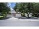 Exterior view of three-car garage and driveway at 1274 White Oak Trl, Port Charlotte, FL 33948