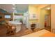 Open kitchen with white cabinets, island, and breakfast bar at 1274 White Oak Trl, Port Charlotte, FL 33948