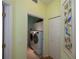 Laundry room with washer, dryer, and built-in cabinets at 1274 White Oak Trl, Port Charlotte, FL 33948