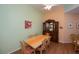 Bright dining area with table, chairs, and hutch at 1274 White Oak Trl, Port Charlotte, FL 33948