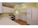 Well-equipped kitchen with white cabinets and modern appliances at 1274 White Oak Trl, Port Charlotte, FL 33948