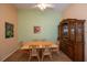 Dining room with wooden hutch and wicker dining set at 1274 White Oak Trl, Port Charlotte, FL 33948