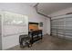 Garage with workbench, generator, and storage cabinets at 1274 White Oak Trl, Port Charlotte, FL 33948
