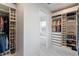 Spacious walk-in closet with custom organizers and natural light at 1735 Boca Raton Ct, Punta Gorda, FL 33950