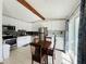 Bright and updated kitchen with stainless steel appliances and breakfast table at 14300 Worthwhile Rd, Port Charlotte, FL 33953