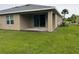 Spacious backyard with covered patio and grassy area at 7633 W Lenox Cir, Punta Gorda, FL 33950