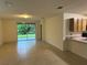 Spacious living room with tile floors and access to patio at 7633 W Lenox Cir, Punta Gorda, FL 33950