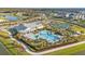 Resort-style pool with lounge chairs and a clubhouse in a new community at 1530 Laurel Brook Ln, Port Charlotte, FL 33953