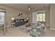 Cozy living room featuring a sofa, chairs, and access to a patio at 1530 Laurel Brook Ln, Port Charlotte, FL 33953