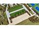 Aerial view of bocce ball courts and surrounding landscaping at 1530 Laurel Brook Ln, Port Charlotte, FL 33953