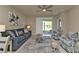 Living Room with comfortable seating and access to backyard at 1530 Laurel Brook Ln, Port Charlotte, FL 33953