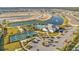 Aerial view of community with pool, clubhouse, and pickleball courts at 1530 Laurel Brook Ln, Port Charlotte, FL 33953
