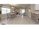Open concept dining area with wood-look floors at 1530 Laurel Brook Ln, Port Charlotte, FL 33953