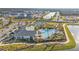Aerial view showing clubhouse, pool, and surrounding landscape at 1530 Laurel Brook Ln, Port Charlotte, FL 33953