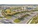 Landscaped entrance to the community with signage and palm trees at 1530 Laurel Brook Ln, Port Charlotte, FL 33953