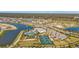 Aerial view of community with lake, pool, and various amenities at 1530 Laurel Brook Ln, Port Charlotte, FL 33953