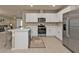 Modern kitchen with white cabinets, stainless steel appliances, and an island at 1530 Laurel Brook Ln, Port Charlotte, FL 33953