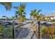 Relaxing resort-style pool with lounge chairs and lush landscaping at 1530 Laurel Brook Ln, Port Charlotte, FL 33953